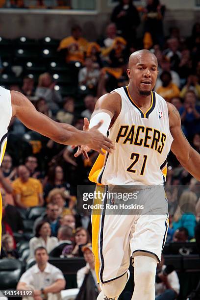 David West of the Indiana Pacers high fives his teammate during the game against the Orlando Magic in Game One of the Eastern Conference...