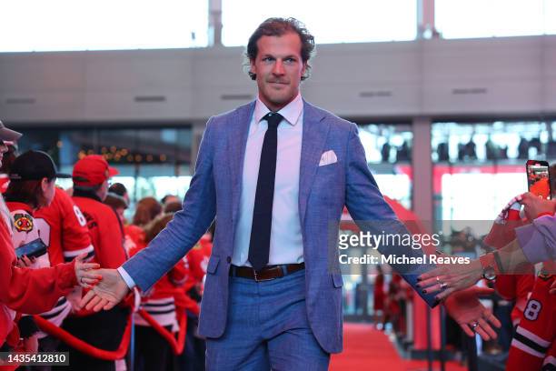 Jake McCabe of the Chicago Blackhawks arrives to the red carpet prior to the game against the Detroit Red Wings at United Center on October 21, 2022...