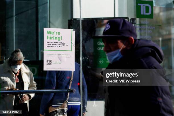 Now Hiring" sign is displayed on a shopfront on October 21, 2022 in New York City. New employment statistics show that in the past month, the jobless...