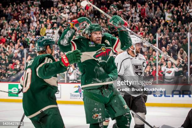 Marcus Foligno celebrates his goal with his teammate Tyson Jost of the Minnesota Wild against the Los Angeles Kings during the game at the Xcel...