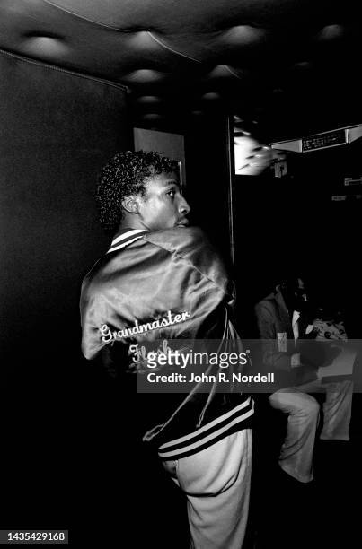 American DJ and rapper Grandmaster Flash, of the American hip hop group Grandmaster Flash and the Furious Five, poses for a portrait backstage during...
