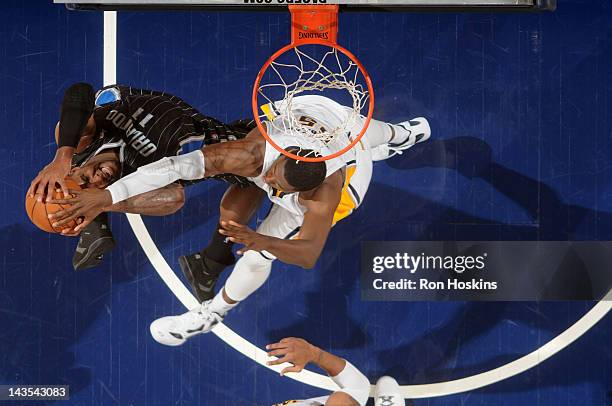 Roy Hibbert of the Indiana Pacers blocks a shot by Glen Davis of the Orlando Magic in Game One of the Eastern Conference Quarterfinals during the...