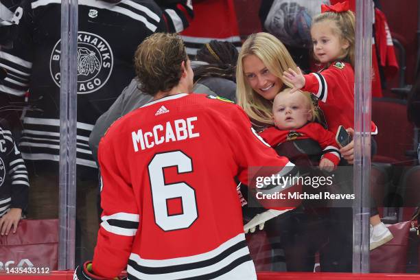 Jake McCabe of the Chicago Blackhawks interacts with fans prior to the game against the Detroit Red Wings at United Center on October 21, 2022 in...