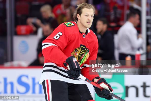 Jake McCabe of the Chicago Blackhawks warms up prior to the game against the Detroit Red Wings at United Center on October 21, 2022 in Chicago,...