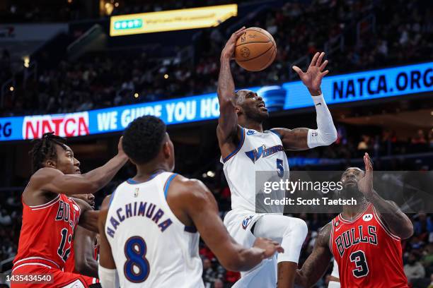 Will Barton of the Washington Wizards goes to the basket against Andre Drummond of the Chicago Bulls during the first half at Capital One Arena on...