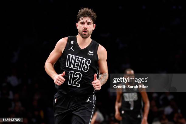 Joe Harris of the Brooklyn Nets jogs on the court during the first half against the Toronto Raptors at Barclays Center on October 21, 2022 in the...