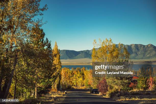 an autumn street overlooking crowley lake - mammoth lakes stock pictures, royalty-free photos & images