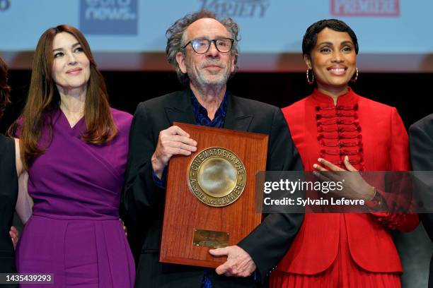 Monica Bellucci, Tim Burton, Imany attend the Lumiere Award ceremony during the 14th Film Festival Lumiere on October 21, 2022 in Lyon, France.