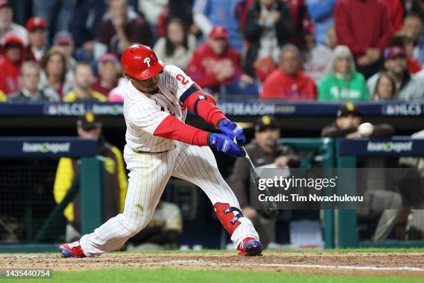 Jean Segura of the Philadelphia Phillies hits a two-run RBI single during the fourth inning against the San Diego Padres in game three of the...