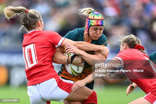 Sharni Williams of Australia is tackled by Elinor Snowsill of Wales during the Pool A Rugby World Cup 2021 match between Australia and Wales at...