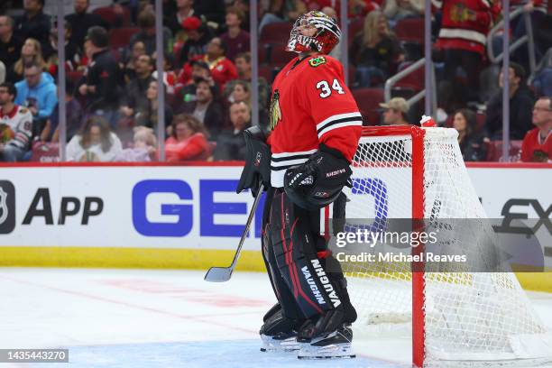 Petr Mrazek of the Chicago Blackhawks reacts after allowing a goal to Dylan Larkin of the Detroit Red Wings during the first period at United Center...