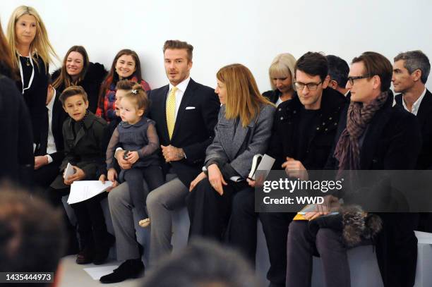 David Beckham with children Harper, Romeo and Cruz at Victoria Beckham\'s fall 2014 runway show at Cafe Rouge.