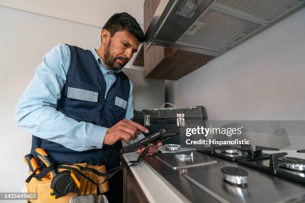 supervisor making a gas inspection at a house - home appliances stock pictures, royalty-free photos & images