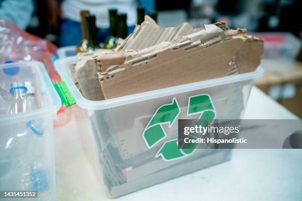 recyclable material in different containers at a waste management centre - circular economy stock pictures, royalty-free photos & images