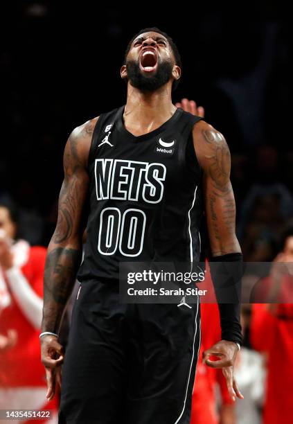 Royce O'Neale of the Brooklyn Nets reacts after making a three-point basket during the second half against the Toronto Raptors at Barclays Center on...