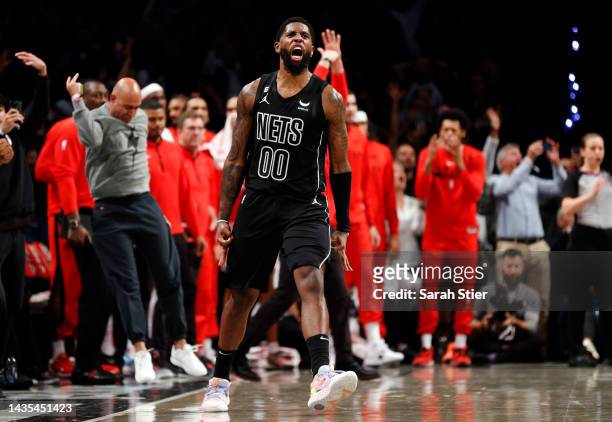 Royce O'Neale of the Brooklyn Nets reacts after making a three-point basket during the second half against the Toronto Raptors at Barclays Center on...