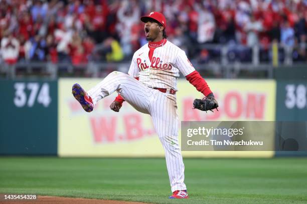 Jean Segura of the Philadelphia Phillies celebrates after making a diving stop and throwing out Ha-Seong Kim of the San Diego Padres at first base...