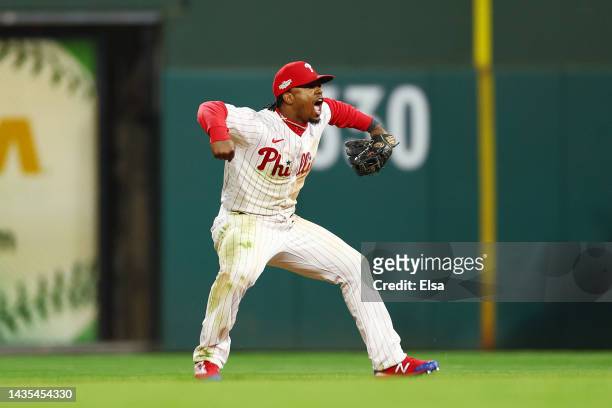 Jean Segura of the Philadelphia Phillies celebrates after making a diving stop and throwing out Ha-Seong Kim of the San Diego Padres at first base...