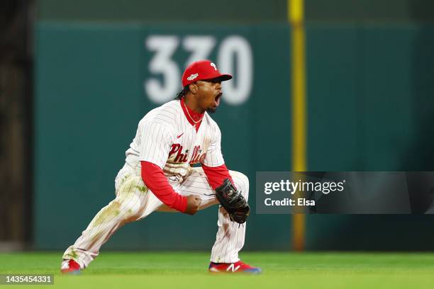 Jean Segura of the Philadelphia Phillies celebrates after making a diving stop and throwing out Ha-Seong Kim of the San Diego Padres at first base...