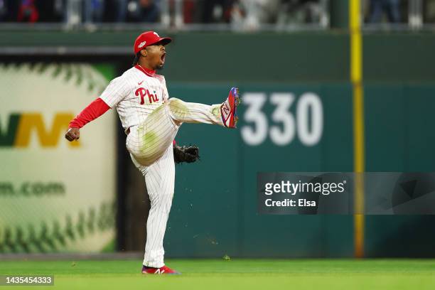 Jean Segura of the Philadelphia Phillies celebrates after making a diving stop and throwing out Ha-Seong Kim of the San Diego Padres at first base...