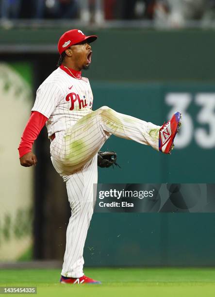 Jean Segura of the Philadelphia Phillies celebrates after making a diving stop and throwing out Ha-Seong Kim of the San Diego Padres at first base...