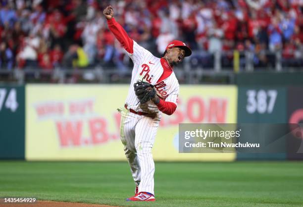 Jean Segura of the Philadelphia Phillies celebrates after making a diving stop and throwing out Ha-Seong Kim of the San Diego Padres at first base...