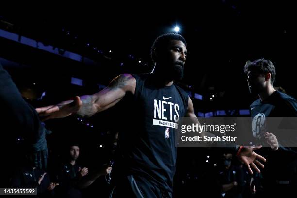 Kyrie Irving of the Brooklyn Nets is introduced before the first half against the Toronto Raptors at Barclays Center on October 21, 2022 in the...
