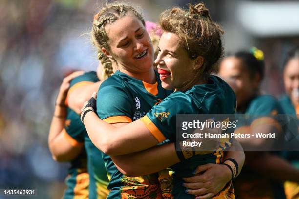 Lori Cramer of Australia and Arabella McKenzie of Australia celebrate the win during the Pool A Rugby World Cup 2021 match between Australia and...