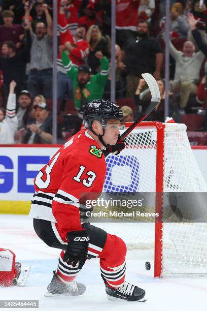 Max Domi of the Chicago Blackhawks celebrates after scoring a game-winning goal in overtime past Alex Nedeljkovic of the Detroit Red Wings at United...