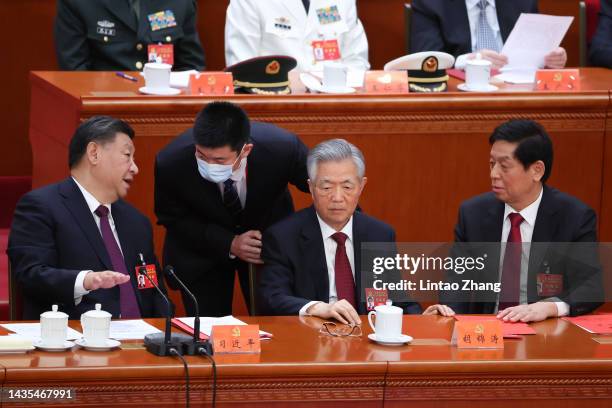 Chinese President Xi Jinping, former President Hu Jintao, and member of the Standing Committee of the Politburo of the Communist Party of China Li...