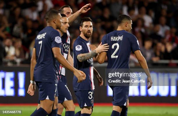 Lionel Messi of PSG celebrates his goal with teammates during the Ligue 1 match between AC Ajaccio and Paris Saint-Germain at Stade Francois Coty on...