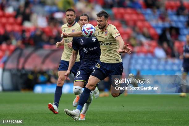 Carl Jenkinson of the Jets competes for the ball with Oskar Zawada of the Phoenix during the round three A-League Men's match between Newcastle Jets...