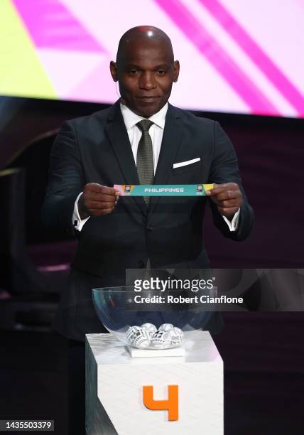 Geremi Njitap is seen on stage during the FIFA Women's World Cup 2023 Final Tournament Draw at Aotea Centre on October 22, 2022 in Auckland, New...