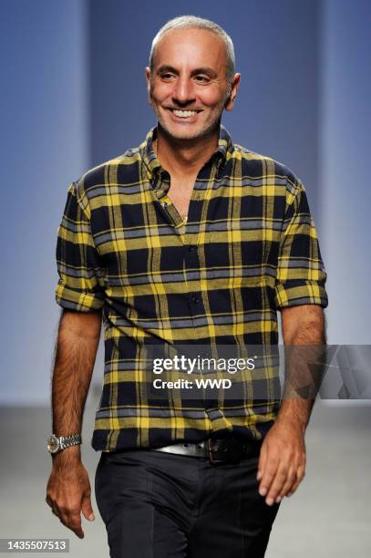 Fashion designer Alessandro Dell'Acqua on the runway after No. 21's spring 2014 show.