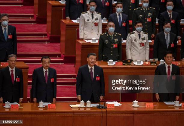 Chinese President Xi Jinping, centre, and Premier Li Keqiang during the closing session of the 20th National Congress of the Communist Party of...