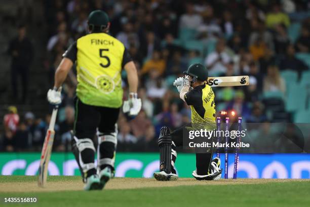 David Warner of Australia is dismissed by Tim Southee of New Zealand during the ICC Men's T20 World Cup match between Australia and New Zealand at...