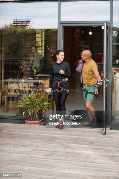 two climber leaving the indoor rock climbing center - open practice stock pictures, royalty-free photos & images