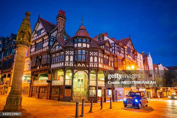 chester chester cross in bridge street at sunset in england uk - tudor style home stock pictures, royalty-free photos & images