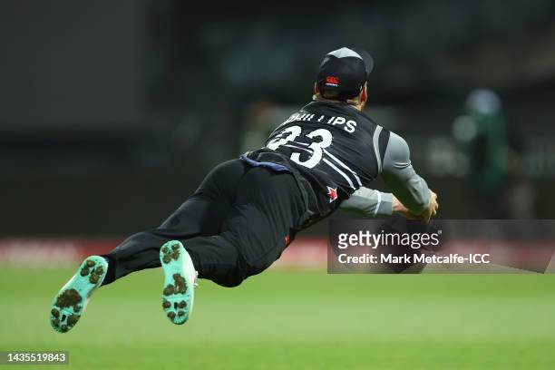 Glenn Phillips of New Zealand catches out Marcus Stoinis of Australia during the ICC Men's T20 World Cup match between Australia and New Zealand at...