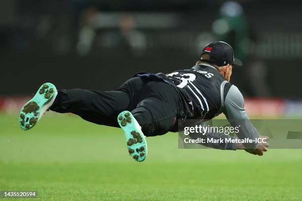 Glenn Phillips of New Zealand catches out Marcus Stoinis of Australia during the ICC Men's T20 World Cup match between Australia and New Zealand at...