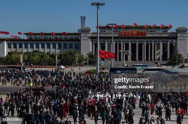 Delegates, officials and journalists, leave the closing session of the 20th National Congress of the Communist Party of China, at The Great Hall of...