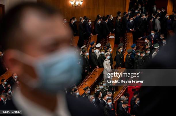 Chinese military delegates leave the closing session of the 20th National Congress of the Communist Party of China, at The Great Hall of People on...