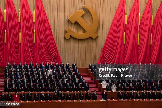 Chinese President Xi Jinping, bottom centre, and senior members of the government stand for the national anthem at the end of the closing session of...