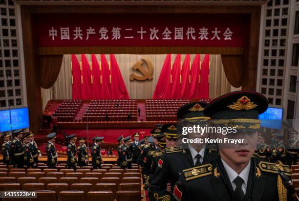 Members of the Peoples Liberation Army band file out after the closing session of the 20th National Congress of the Communist Party of China, outside...