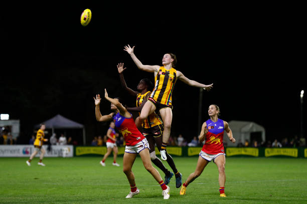 Aileen Gilroy of Hawthorn leaps over Sophie Conway of Brisbane during the round nine AFLW match between the Hawthorn Hawks and the Brisbane Lions at...