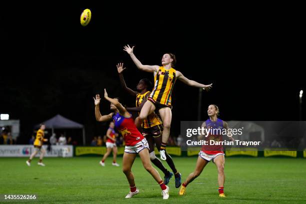 Aileen Gilroy of Hawthorn leaps over Sophie Conway of Brisbane during the round nine AFLW match between the Hawthorn Hawks and the Brisbane Lions at...