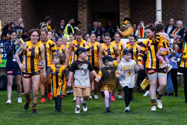 Hawthorn players run out before the round nine AFLW match between the Hawthorn Hawks and the Brisbane Lions at SkyBus Stadium on October 22, 2022 in...