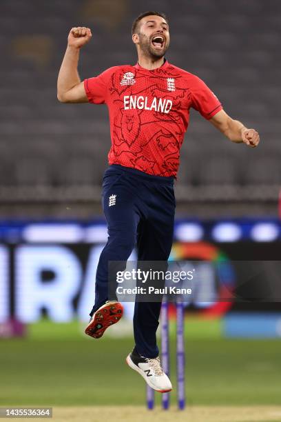 Mark Wood of England celebrates the wicket of Rahmanullah Gurbaz of Afghanistan during the ICC Men's T20 World Cup match between England and...