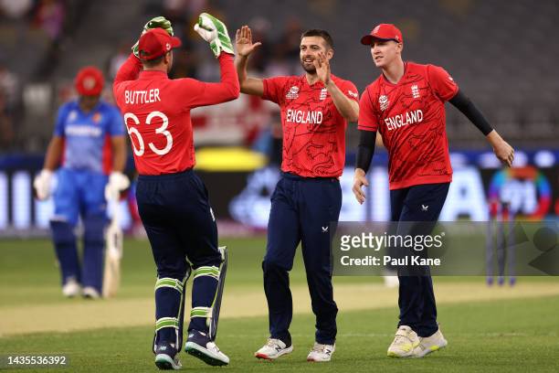 Mark Wood of England celebrates the wicket of Rahmanullah Gurbaz of Afghanistan during the ICC Men's T20 World Cup match between England and...