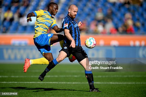 Anthony Ujah of Eintracht Braunschweig and Jannis Heuer of SC Paderborn 07 battle for possession during the Second Bundesliga match between Eintracht...